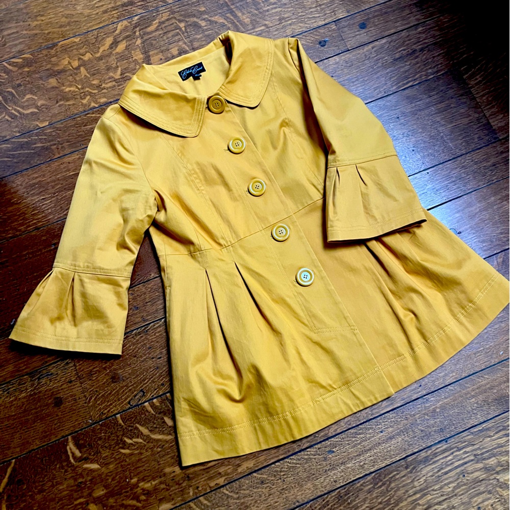 Casual light weight, mustard colored jacket with bell sleeves.